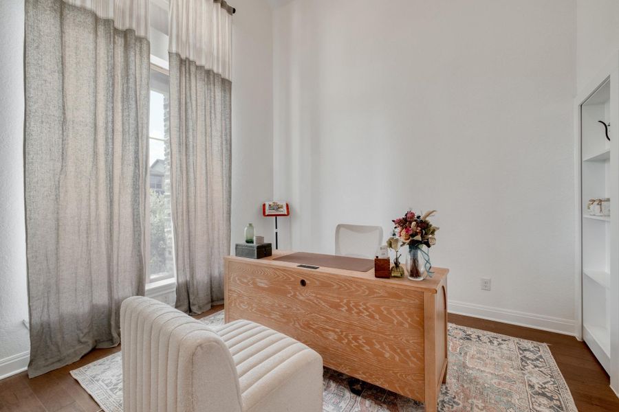 The versatile private office comes with a Murphy bookcase hiding bonus storage or your very own secret room.