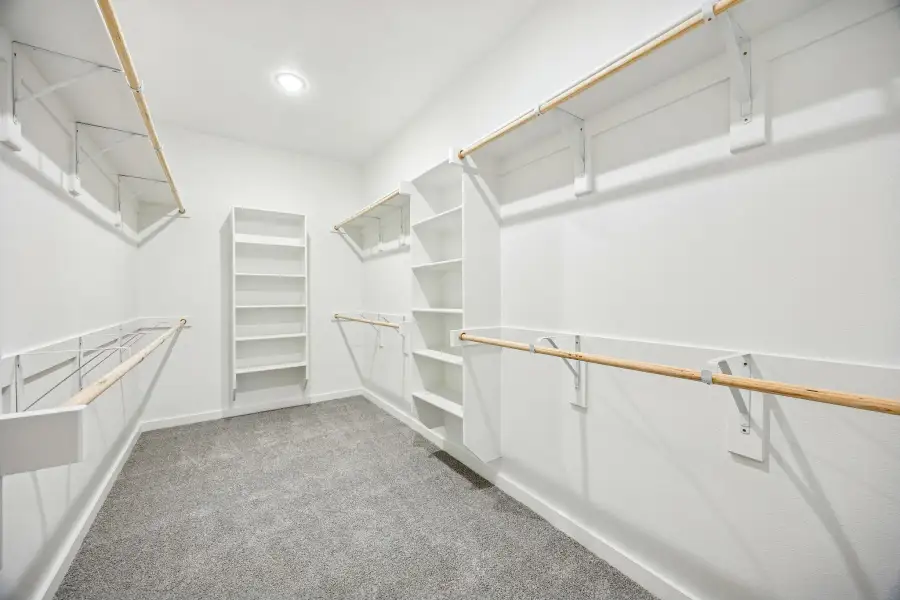 Primary Closet in the Willow home plan by Trophy Signature Homes – REPRESENTATIVE PHOTO Primary Closet in the Willow home plan by Trophy Signature Homes – REPRESENTATIVE PHOTO