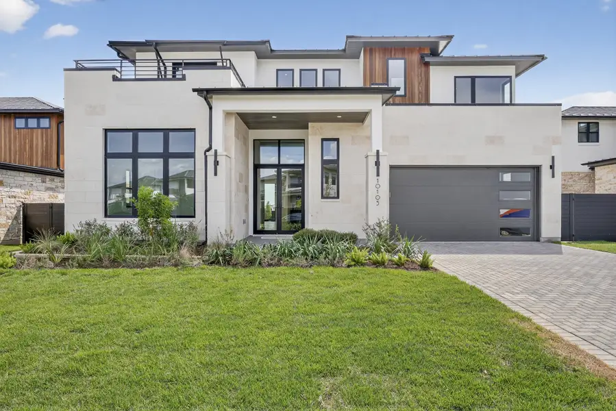 Exterior details and patio area of a home in Milky Way at River Place, Austin (Image 1).