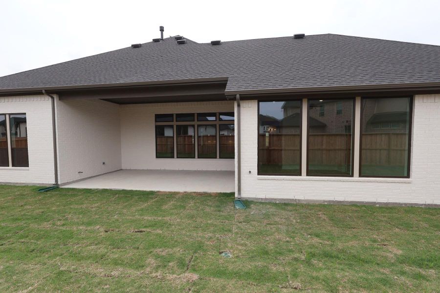 Exterior details and patio area of a home in Dunham Pointe, Cypress (Image 23). Exterior details and patio area of a home in Dunham Pointe, Cypress (Image 23).