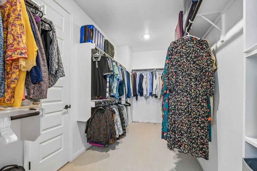 Ample hanging space and integrated shelving create a highly functional storage solution.