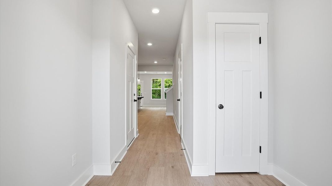 Elegant foyer with hardwood flooring and tasteful trim detail creates a memorable first impression in Simpsonville, SC