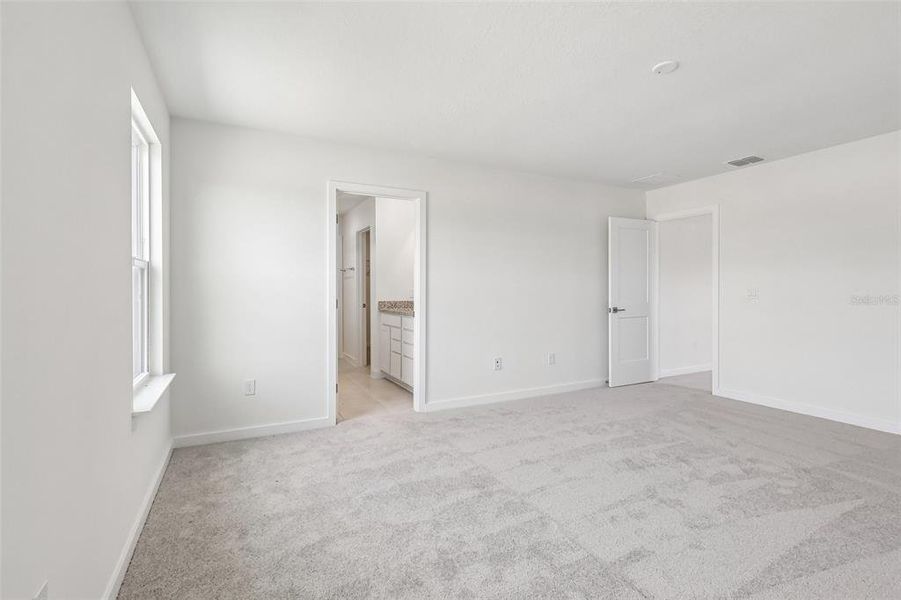 Spacious, unfurnished interior of a new home in Grasslands West, Lakeland (Image 21).