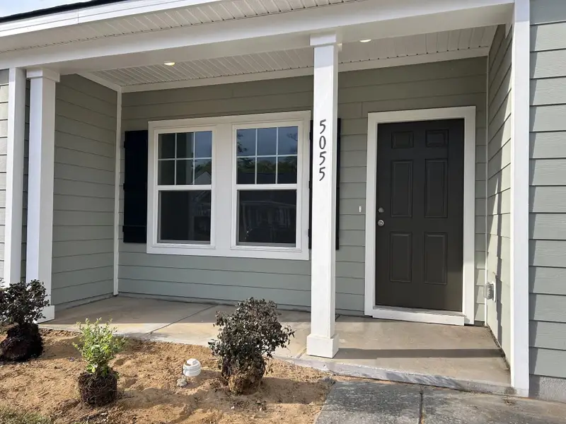 Exterior details and patio area of a home in Tea Farm, Ravenel (Image 4). Exterior details and patio area of a home in Tea Farm, Ravenel (Image 4).