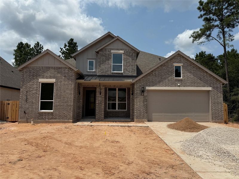 Front exterior of a new home in COLTON: 60ft. lots, Magnolia, TX, highlighting curb appeal (Image 1). Front exterior of a new home in COLTON: 60ft. lots, Magnolia, TX, highlighting curb appeal (Image 1).