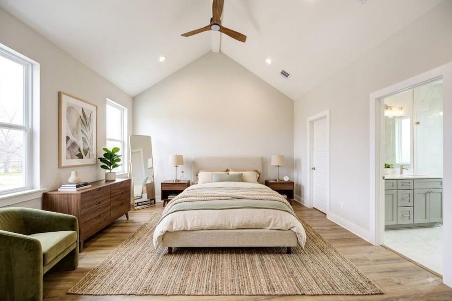 Larger appointed primary suite with vaulted ceilings, and  abundant natural lighting. The perfect retreat from the urban city life.