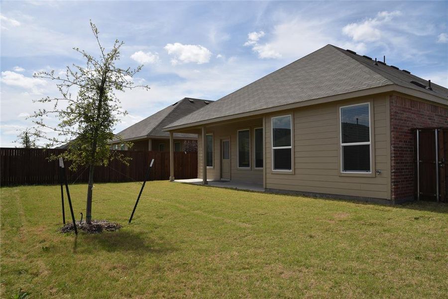 Exterior details and patio area of a home in Walden Pond, Forney (Image 4).