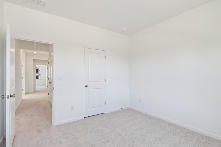 Spacious, unfurnished interior of a new home in Terraces at the Exchange, Indian Land (Image 29).