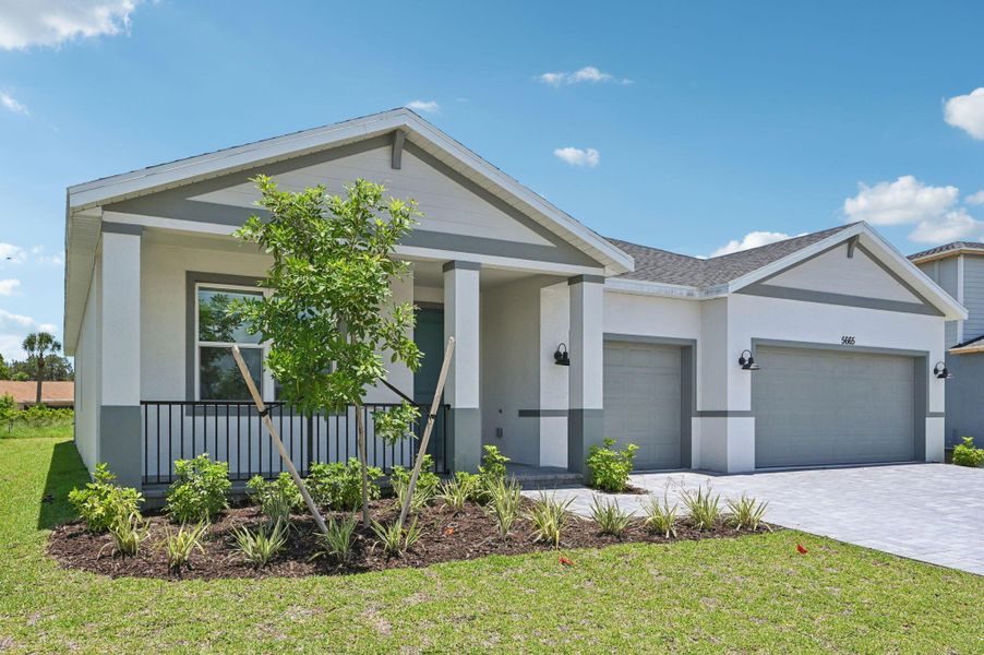 Front exterior of a new home in Hampton Park - Signature Series, Vero Beach, FL, highlighting curb appeal (Image 16).