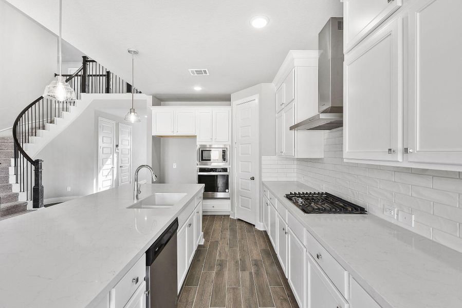 Furnished interior view inside a new home in Sunterra, Katy (Image 11).