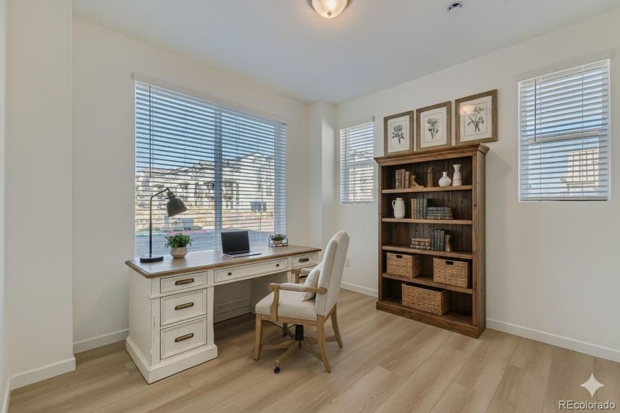 Bedroom 3 on the main level. Staged.