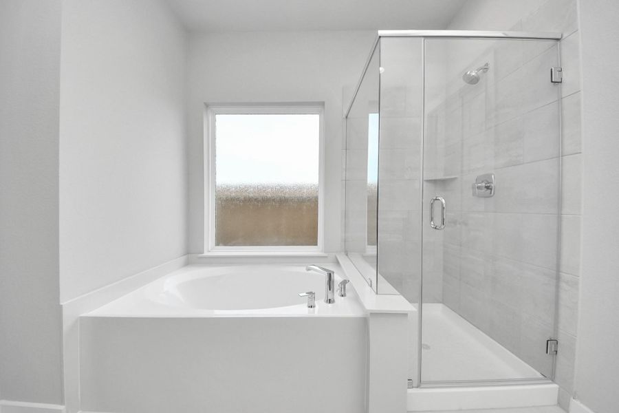 Experience a spa-like escape right in the heart of your primary bathroom! Sample photo of completed home with similar floor plan. Actual colors and selections may vary. Experience a spa-like escape right in the heart of your primary bathroom! Sample photo of completed home with similar floor plan. Actual colors and selections may vary.