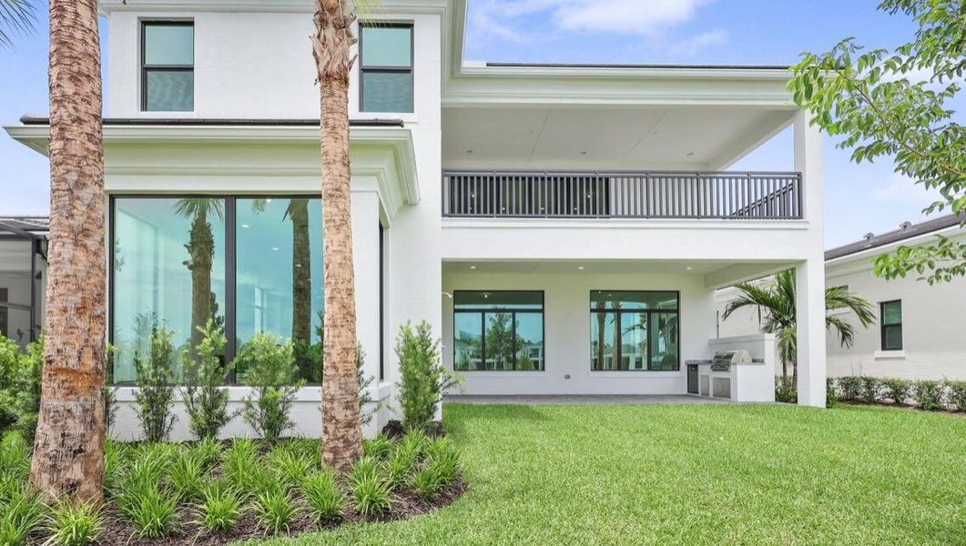 Front exterior of a new home in Artistry Palm Beach, Palm Beach Gardens, FL, highlighting curb appeal (Image 26). Front exterior of a new home in Artistry Palm Beach, Palm Beach Gardens, FL, highlighting curb appeal (Image 26).