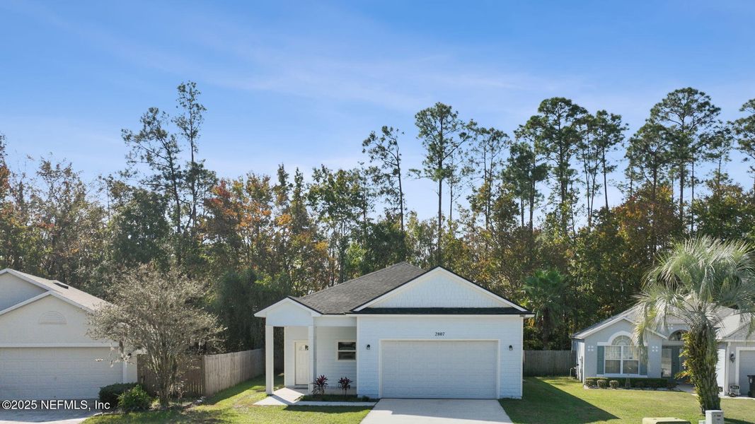 Front exterior of a new home in , Middleburg, FL, highlighting curb appeal (Image 26).
