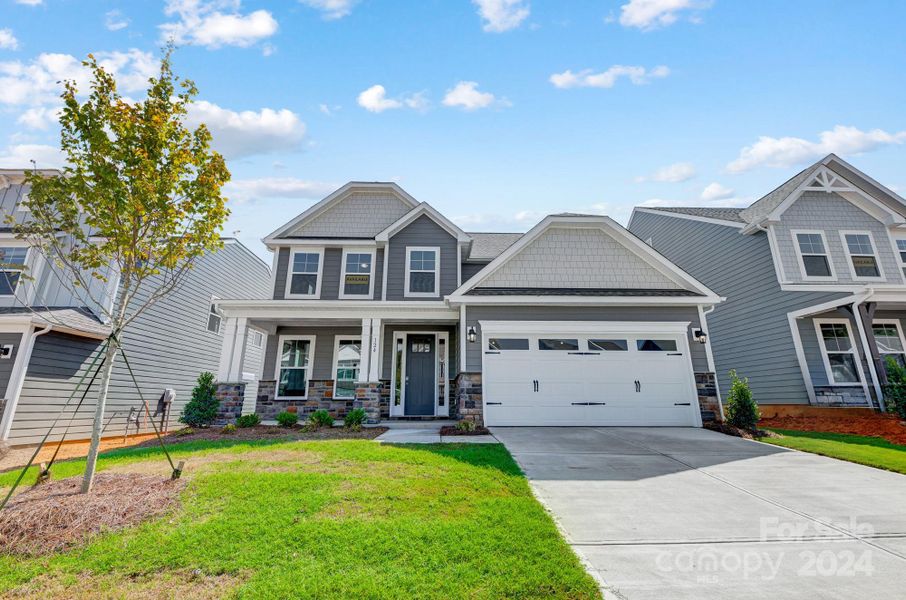 MOVE-IN READY! Homesite 19 features a Cypress F floorplan with front-load garage.