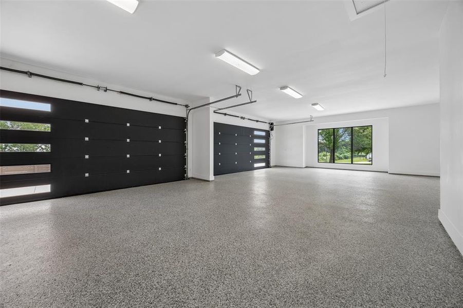 4 car over sized garage with epoxy floors.