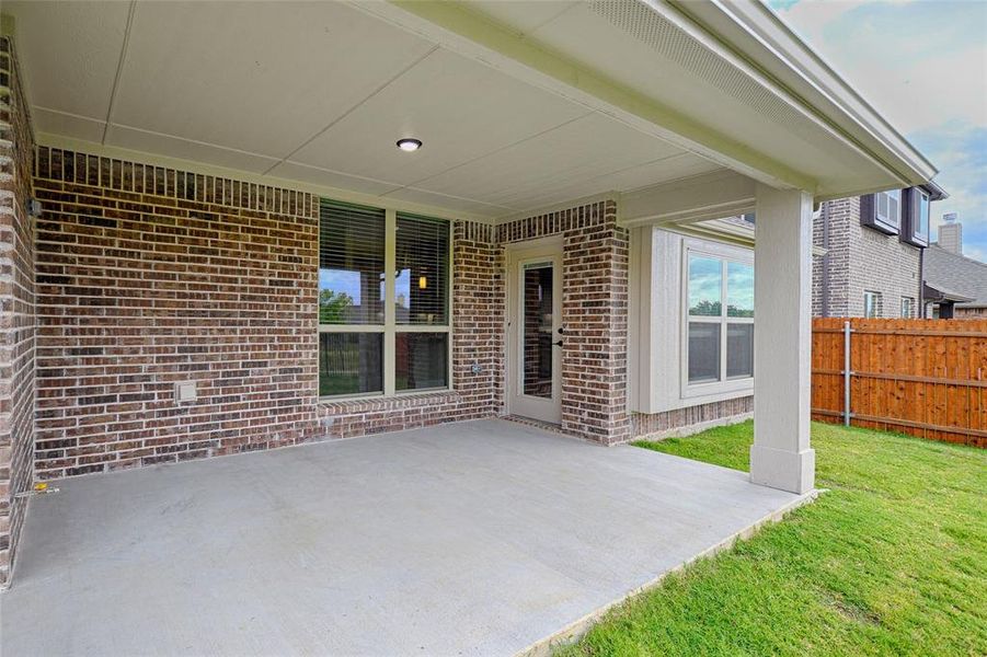 Exterior details and patio area of a home in Parks at Panchasarp Farms, Burleson (Image 3).