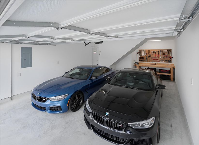 Three car tandem garage. Space for 5 vehicles with private driveway Three car tandem garage. Space for 5 vehicles with private driveway