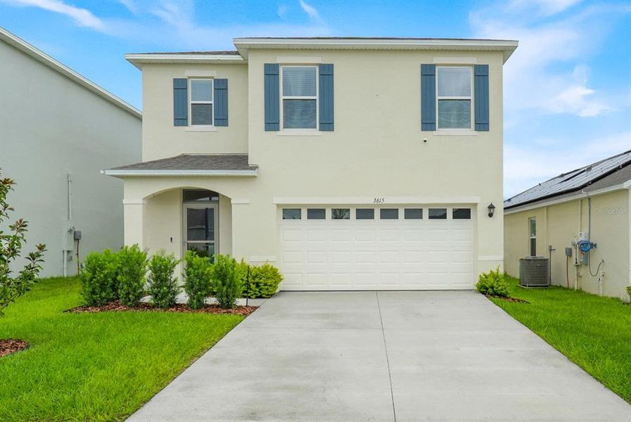Front exterior of a new home in Avalon Park Tavares, Tavares, FL, highlighting curb appeal (Image 2). Front exterior of a new home in Avalon Park Tavares, Tavares, FL, highlighting curb appeal (Image 2).