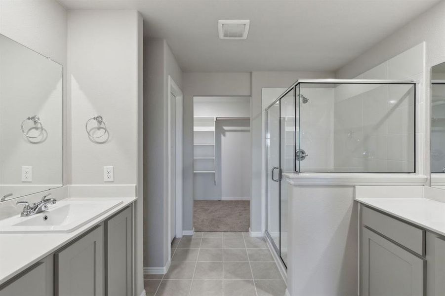 Primary Bathroom in the Harrison home plan by Trophy Signature Homes – REPRESENTATIVE PHOTO