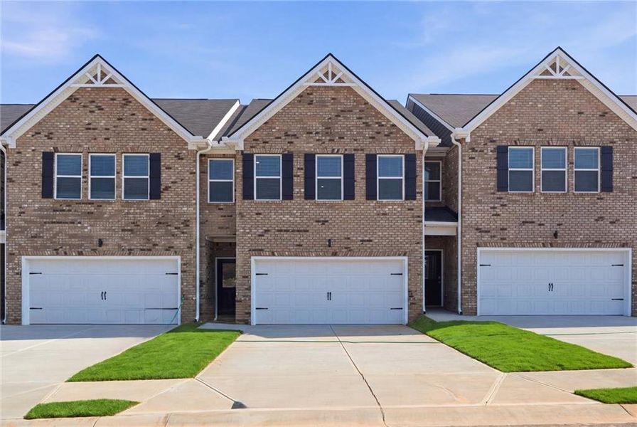 Front exterior of a new home in Parkway James, Snellville, GA, highlighting curb appeal (Image 2). Front exterior of a new home in Parkway James, Snellville, GA, highlighting curb appeal (Image 2).