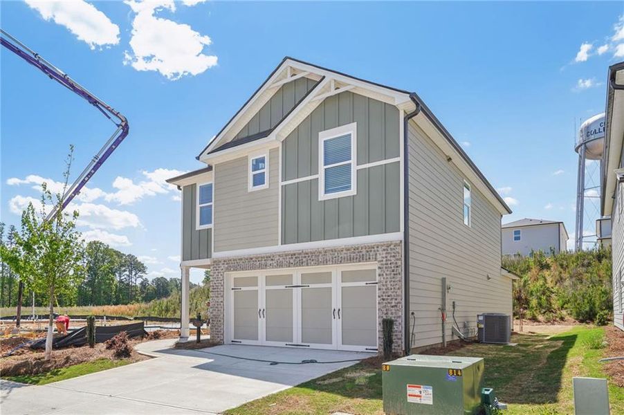 Front exterior of a new home in Hawthorne Station, College Park, GA, highlighting curb appeal (Image 22).