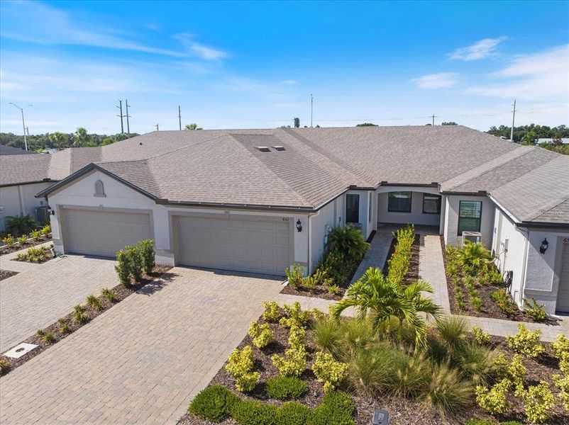 Front exterior of a new home in , Sarasota, FL, highlighting curb appeal (Image 22).