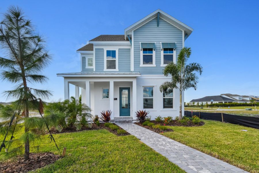 Front exterior of a new home in Emerald Landing at Waterside at Lakewood Ranch – Cottage Series, Sarasota, FL, highlighting curb appeal (Image 2).
