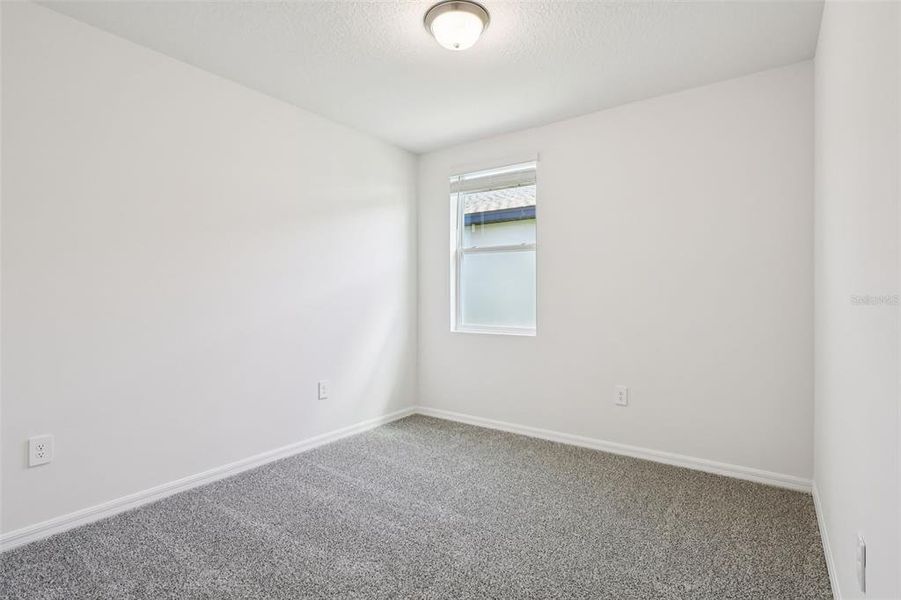 Spacious, unfurnished interior of a new home in Lake Deer Estates - Signature Series, Poinciana (Image 21).