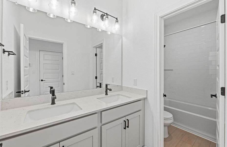Furnished interior view inside a new home in West Cypress Hills, Spicewood (Image 17).