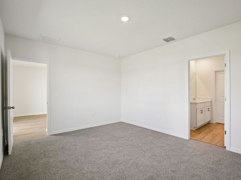 Spacious, unfurnished interior of a new home in The Grove at Stuart Crossing - Premier Series, Bartow (Image 13).