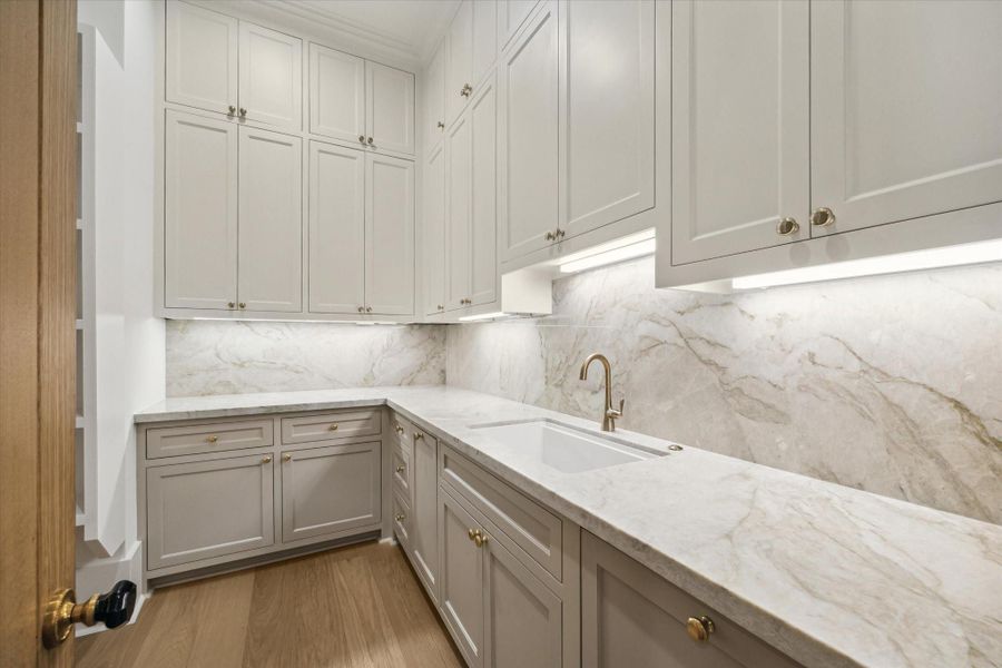 Walk in pantry is truly a scullery - second sink, extra dishwasher, keep all the kitchen prep behind closed doors*Picture is of a recently constructed home by the builder.  1519 Candlelight will be similar in quality, but these pictures are not meant to be an exact representation of the new home. Specs of home may change at sole discretion of the seller.