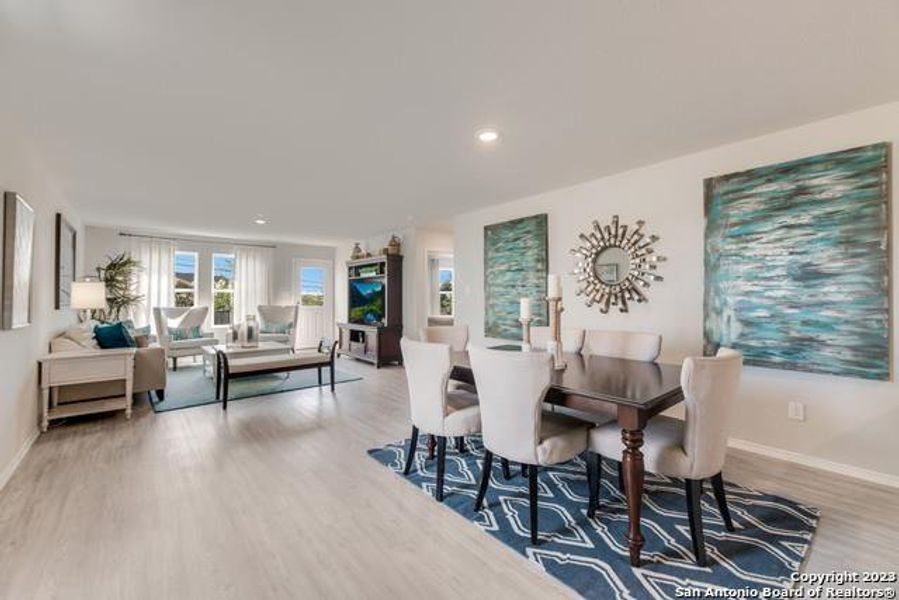 Dining space with wood finished floors and recessed lighting Dining space with wood finished floors and recessed lighting