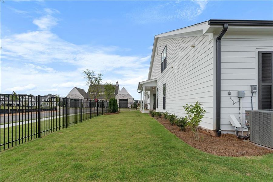 Front exterior of a new home in Promenade at Sawnee Village, Cumming, GA, highlighting curb appeal (Image 30).