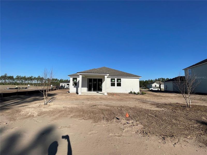 Front exterior of a new home in Magnolia Series at Seminole Palms, Palm Coast, FL, highlighting curb appeal (Image 18).