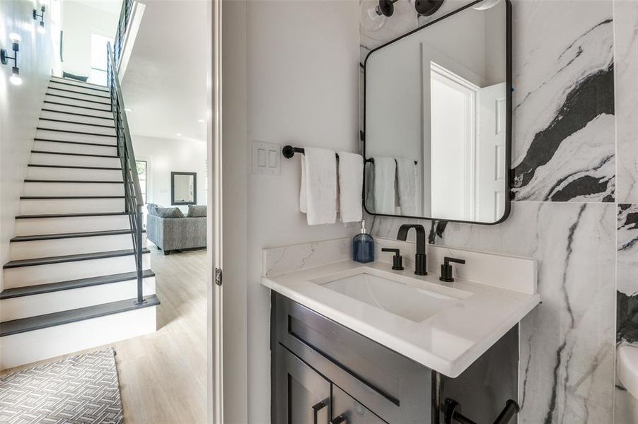 Bathroom with vanity and wood-type flooring