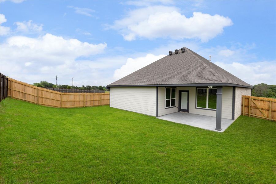 Exterior details and patio area of a home in Vintage Farms, Brenham (Image 25).