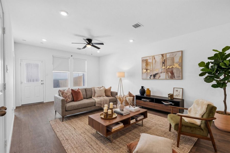 Recessed lighting and warm wood flooring define this comfortable main living space. Recessed lighting and warm wood flooring define this comfortable main living space.