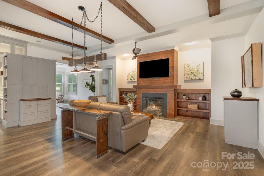 Gorgeous walnut millwork and reclaimed beams make this room cozy and special. Gorgeous walnut millwork and reclaimed beams make this room cozy and special.