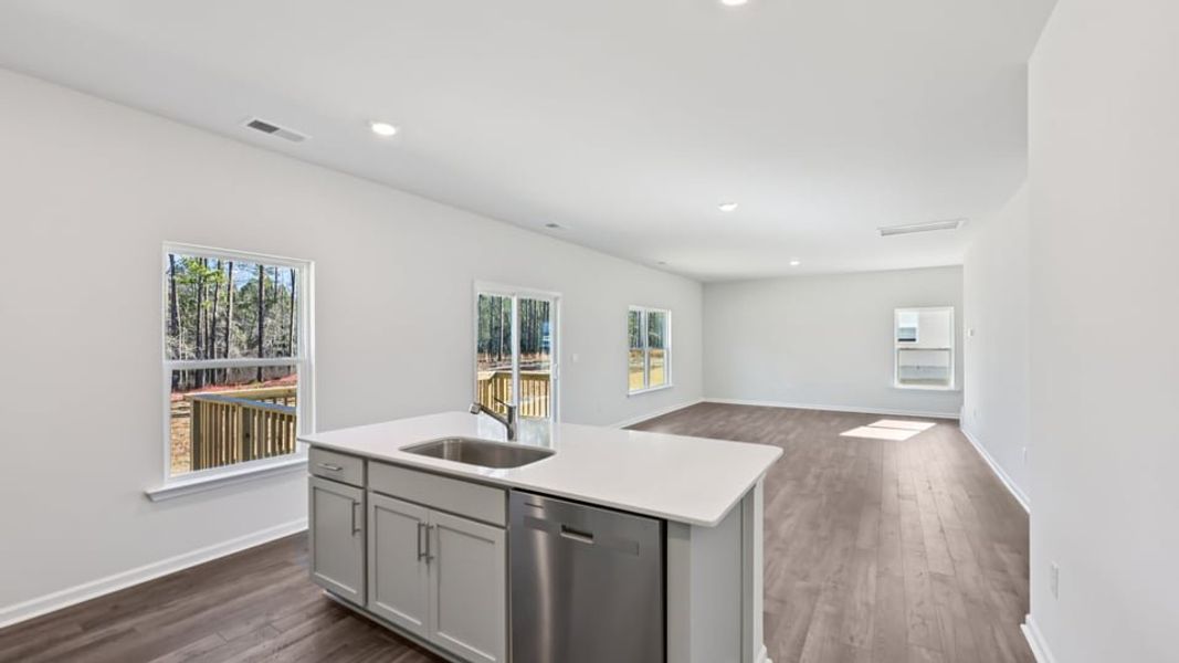 Furnished interior view inside a new home in Gretchen Pines, West End (Image 6).