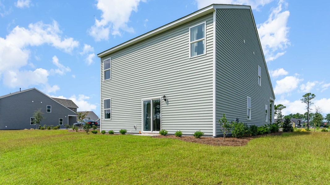 Exterior details and patio area of a home in Indigo Preserve, Leland (Image 3).