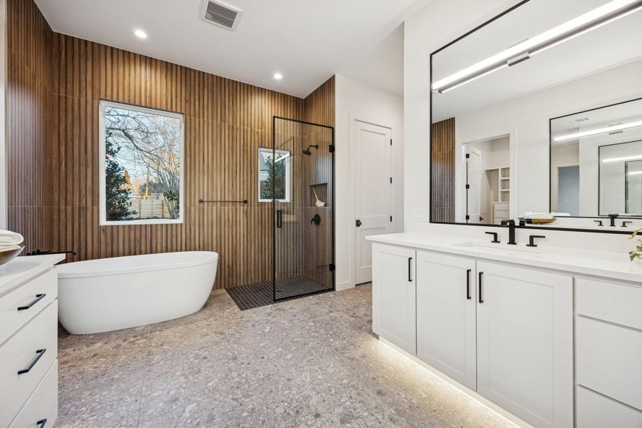 Prime Suite Features - Gorgeous walk in shower, soaking tub, double vanities, and terrazo tile!