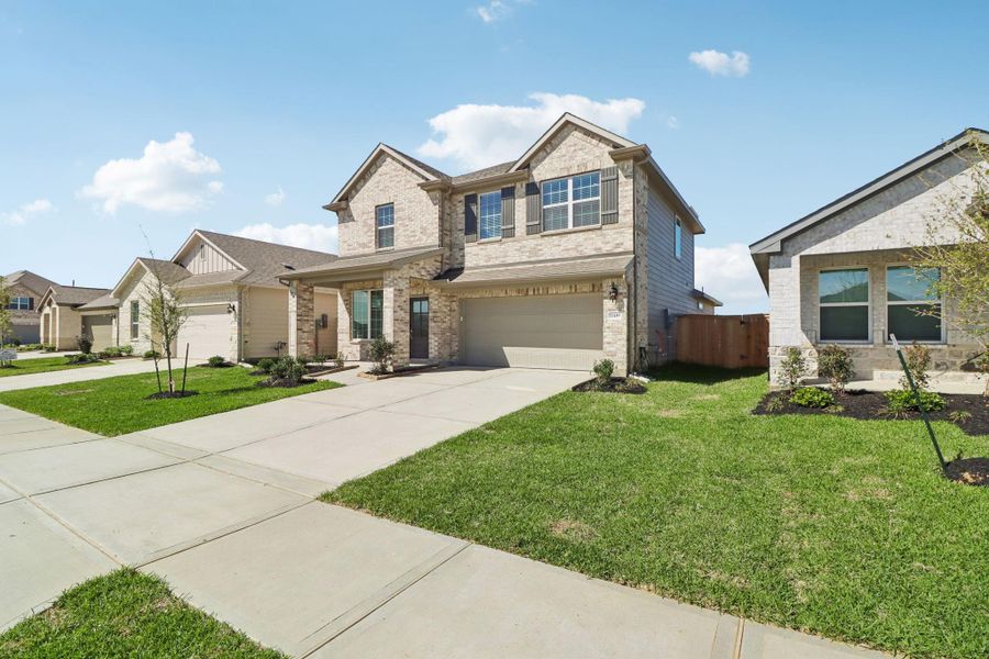Front exterior of a new home in Sanford Farms - Premier Series, Waller, TX, highlighting curb appeal (Image 25).