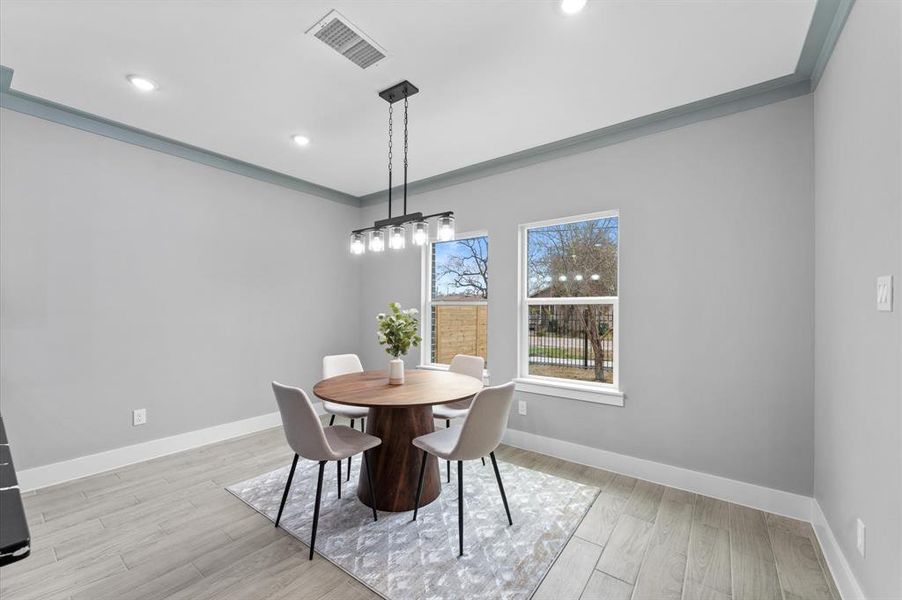 Dining space open to the kitchen and living areas.