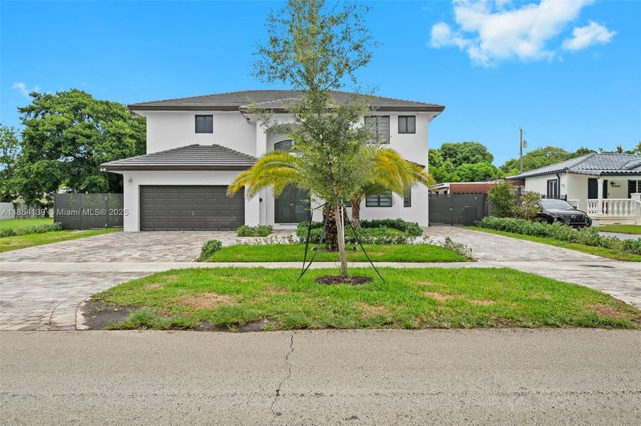 Front exterior of a new home in , Miami Springs, FL, highlighting curb appeal (Image 25).