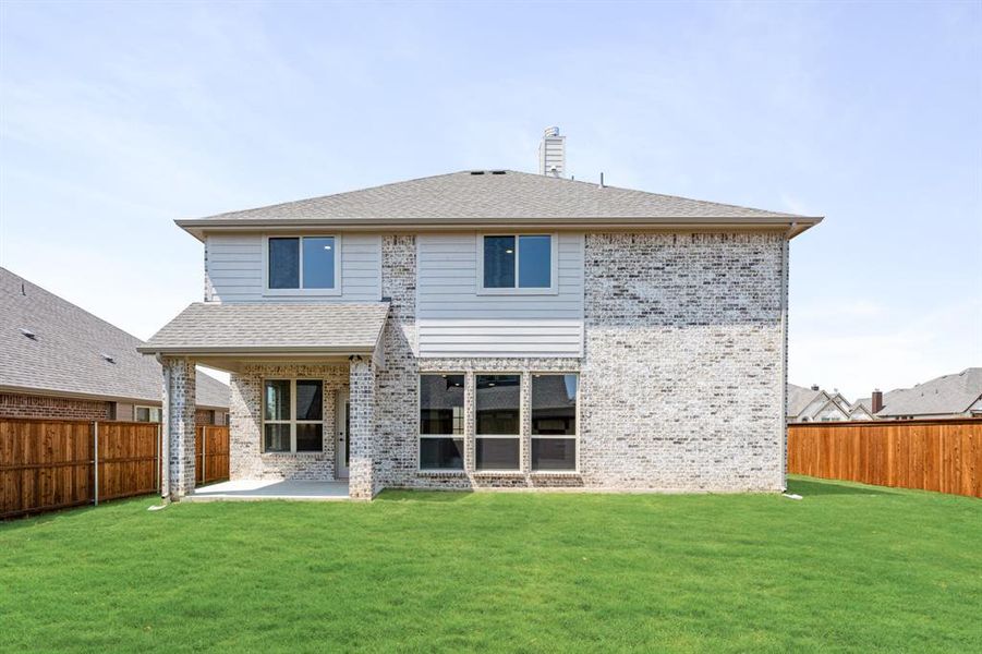 Front exterior of a new home in Mockingbird Hills 60-65, Joshua, TX, highlighting curb appeal (Image 1). Front exterior of a new home in Mockingbird Hills 60-65, Joshua, TX, highlighting curb appeal (Image 1).