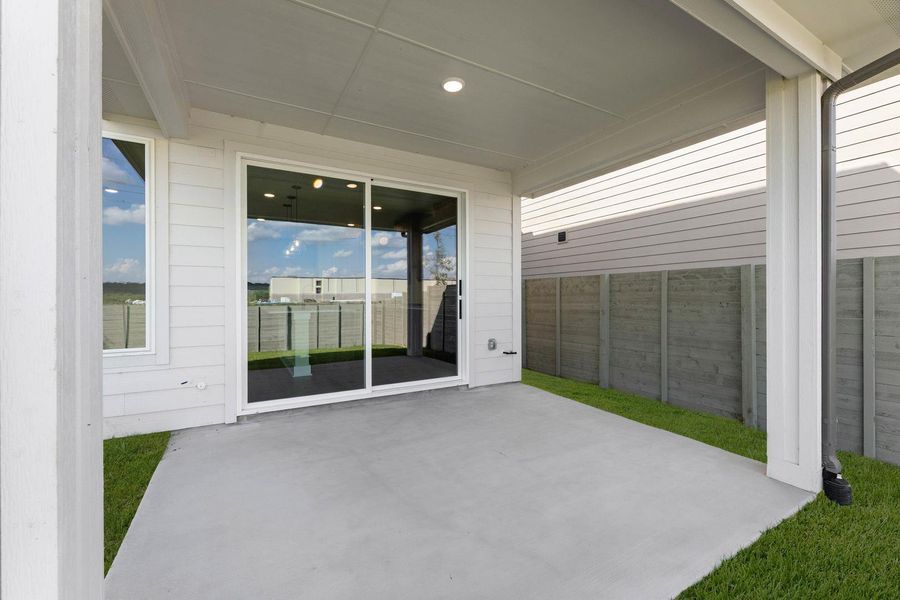Exterior details and patio area of a home in Cottage Collection at Harvest, Argyle (Image 4).
