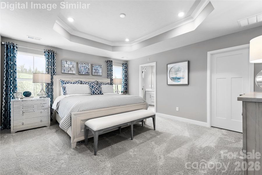 Elegant ensuite retreat featuring two spacious closets and a private bath with refined finishes. Designed for comfort and privacy, this serene space blends luxury with everyday ease.