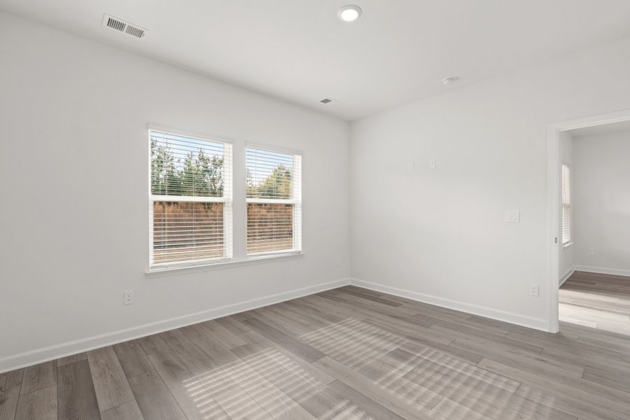 Spacious, unfurnished interior of a new home in Cypress Ridge - The Boardwalk Series, Longs (Image 15).