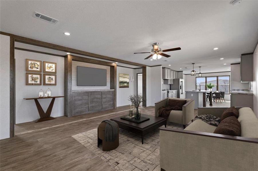 Living area with a ceiling fan, wood finished floors, and recessed lighting